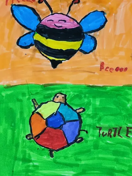 A close-up of the finished artwork featuring a friendly bee and a colorful turtle.
