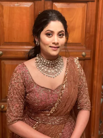 Another shot of the same look, showing the beautiful details of her choker necklace and the soft, blended makeup.