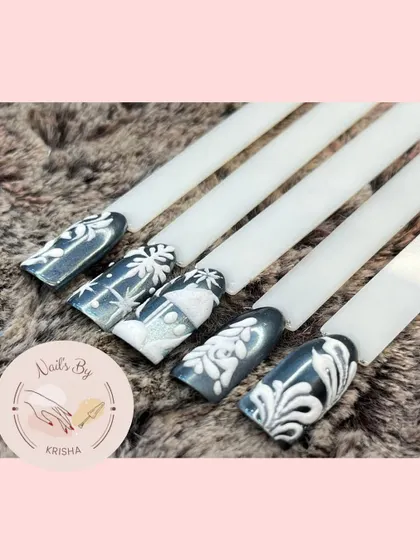A winter-themed set with elegant white 3D art over a dark, shimmery base, creating a beautiful frosty effect.