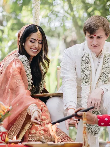 Participating in the wedding rituals together. Their coordinated outfits look beautiful and feel comfortable, allowing them to focus on the moment.