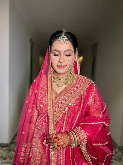 A serene moment captured. The soft, shimmery eyeshadow and perfectly blended base create a flawless canvas, letting the bride's natural beauty take center stage.