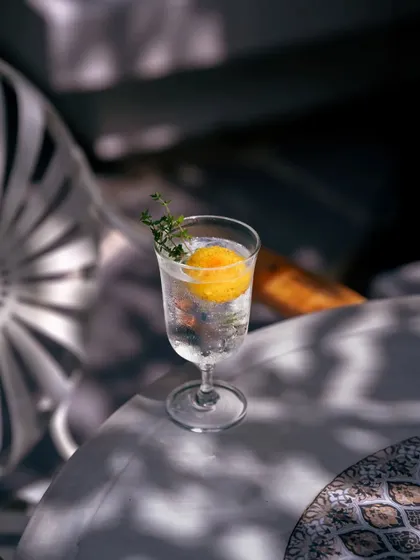 Far from the hustle of everyday life, rest awaits at the bottom of this artisanal cocktail. The 'Glass of Water' is a simple yet profound mix of gin, herbs, and tonic, designed for moments of quiet contemplation in my sun-dappled corners.