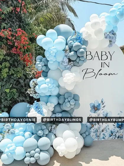 A beautiful "Baby in Bloom" baby shower with an elegant blue floral theme. The balloon cascade in shades of blue and white looks stunning against the outdoor greenery.