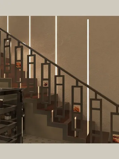 A detailed view of the custom staircase railing, which features a modern geometric pattern. The integrated vertical lighting on the wall behind it creates a dramatic and stylish ascent to the upper level.