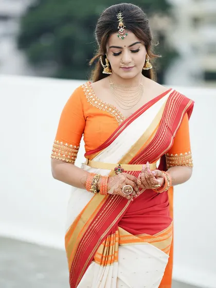 In this photo, you can see how the mehendi, jewelry, and saree all work together to create a stunning, cohesive look for a special occasion.