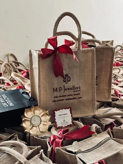 Another view of the festive return gift arrangement, highlighting the beautiful lotus-shaped candle holder.