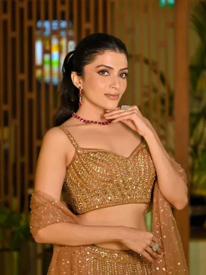 A classic smokey eye paired with a nude lip is a timeless combination for a sangeet night. I created this look to be dramatic yet elegant, perfect for a night of celebration.