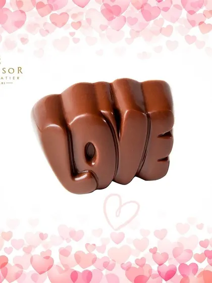 Spell it out with this solid milk chocolate 'LOVE' sculpture. It's a bold and delicious way to share your feelings.