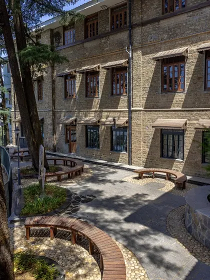 In response to the pandemic, we reimagined a disused open space into an outdoor learning environment. Using materials already on-site, these curved benches and quiet corners demonstrate circularity and how thoughtful design can create spaces for contemplation and connection.