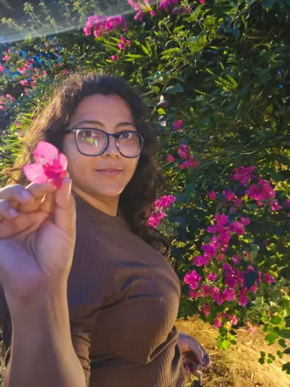 Holding a flower, this self-portrait is about connecting with nature. It’s a simple, body-positive image that embraces the moment.