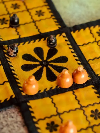 Another beautiful traditional board game, offering a glimpse into the rich history of play and leisure.