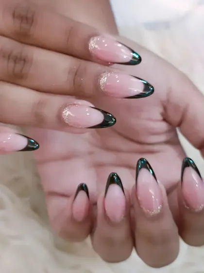 Another view of the elegant black and gold glitter French manicure, showcasing its sleek and polished finish.