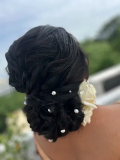 A textured low bun with pearl details, created for a bridal client. This style is both modern and timeless.