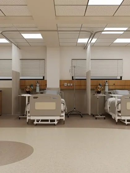 Even in a multi-bed ward, we create a sense of personal space. This image shows how we use subtle design elements, like designated floor patterns and thoughtfully placed artwork, to define each patient's area and add a touch of warmth.