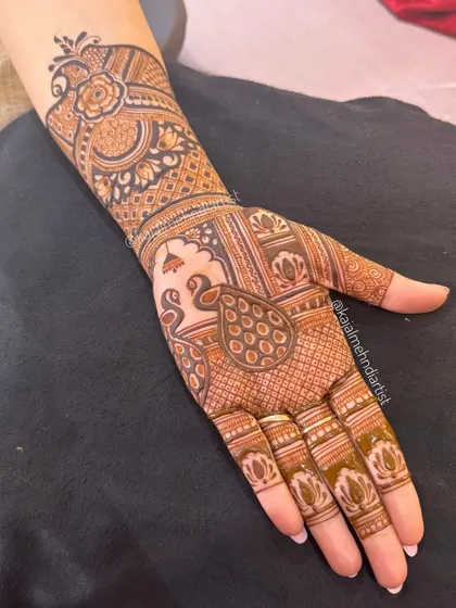 The same beautiful peacock design, showing how it looks with a fresh, dark henna stain.