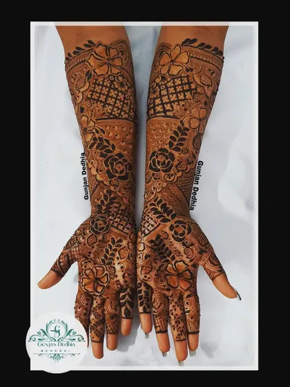 A custom full-hand floral design. The pattern is dense with flowers and leaves, creating a lush, garden-like effect that is perfect for any celebration.