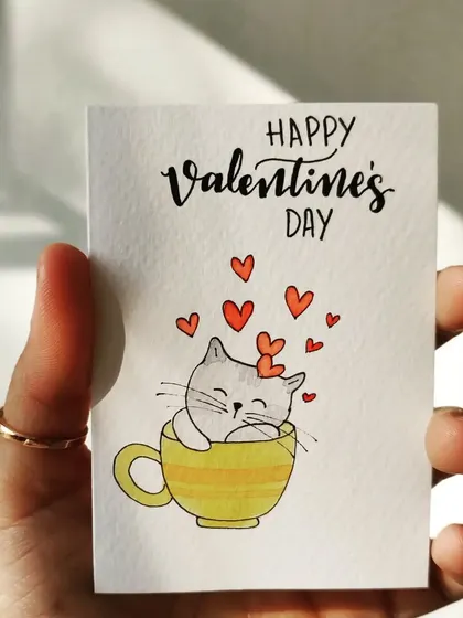 A purr-fectly cute Valentine's Day card featuring a happy cat in a teacup. This simple hand-drawn illustration is a sweet way to send love to any cat lover.