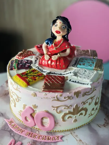To the mom who wears her sarees with grace. This special cake for a 60th birthday celebrates a mother's love for her beautiful sarees, with edible miniatures of her favorites.