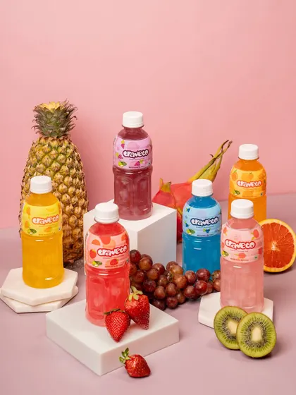 A vibrant group shot showcasing a full range of flavored drinks. I carefully style multiple products with fresh fruit to highlight each flavor, creating a colorful and refreshing image for a summer campaign.