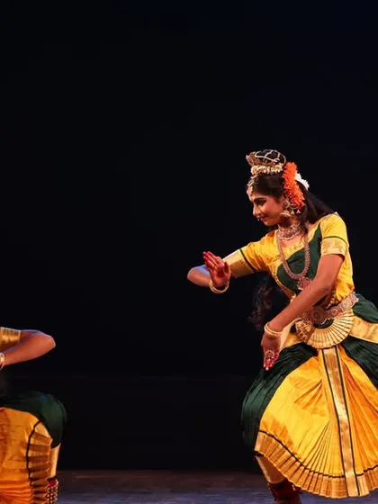A dynamic duet from the Sadhana festival, with both dancers captured in a moment of energetic movement and perfect synchronization.