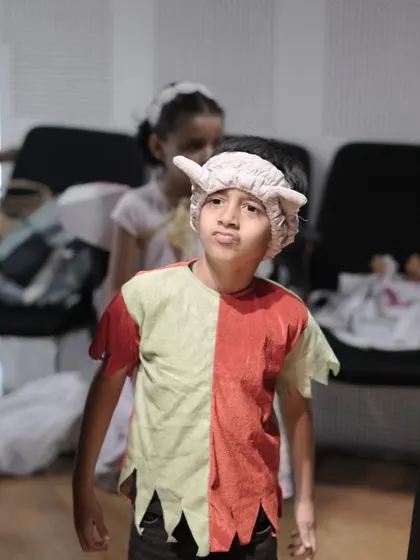 A moment of focus and concentration from a young actor just before making his entrance.