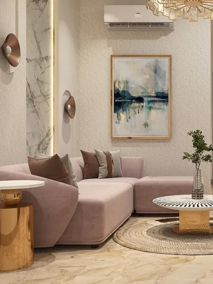 This angle highlights the play of textures and shapes in the lounge. The round jute rug, the cylindrical metallic side table, and the soft curves of the sofa come together to create a harmonious and stylish space.