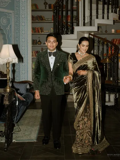 The grand entrance as husband and wife. The couple's elegant outfits and confident walk set the tone for a sophisticated evening celebration.