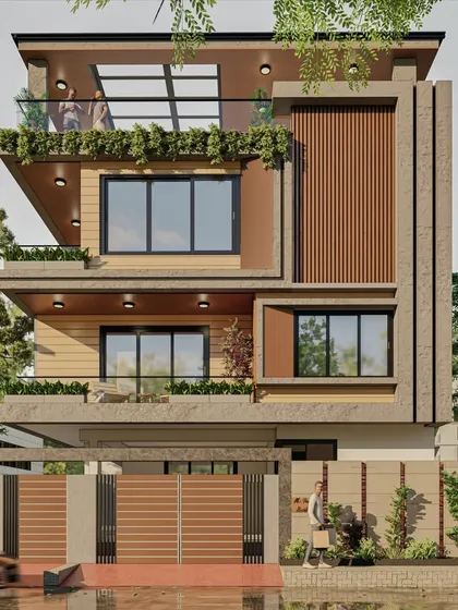 The design for this 40x50 duplex includes a glass-covered terrace, creating a usable outdoor space that is protected from the elements. The planters on the balconies soften the modern structure.