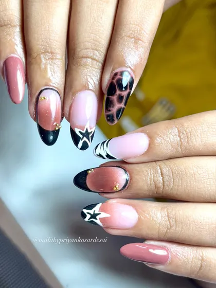 Stars, ombré, and tortie vibes, this set is everything. A creative and edgy mix of different nail art styles that somehow work perfectly together.