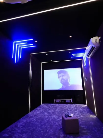 A duplicate of 303, this image shows the room illuminated in a cool blue hue, creating a perfect mood for watching sci-fi movies.