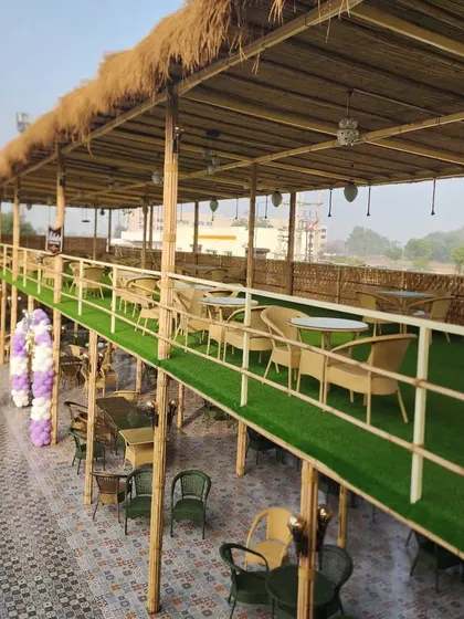 The upper-level seating area at Havanah features artificial turf flooring, providing a comfortable, green, and low-maintenance solution for high-traffic commercial spaces.