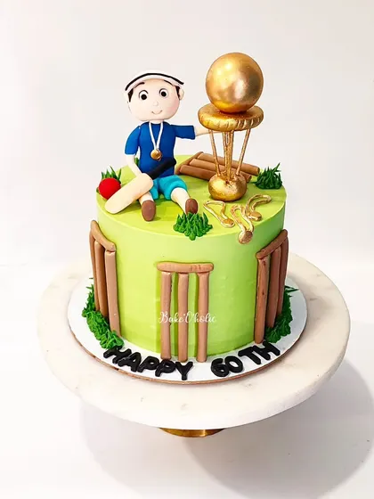 A cake for a die-hard cricket lover celebrating his 60th birthday! This features a custom-made figurine of the birthday boy in his element.