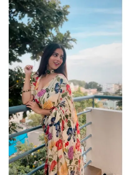Another shot of the floral saree, showcasing its beautiful print and light fabric.