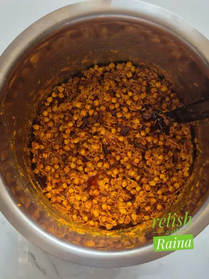 This bowl shows the Chana Kairi pickle mix before the oil is added. You can see the soaked chickpeas mixed with grated raw mango and dry spices. It's a flavour that is both unique and traditional.