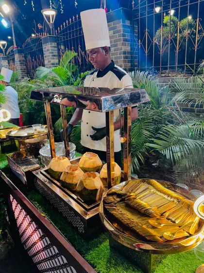 A chef preparing the Coconut Alaska dessert.
