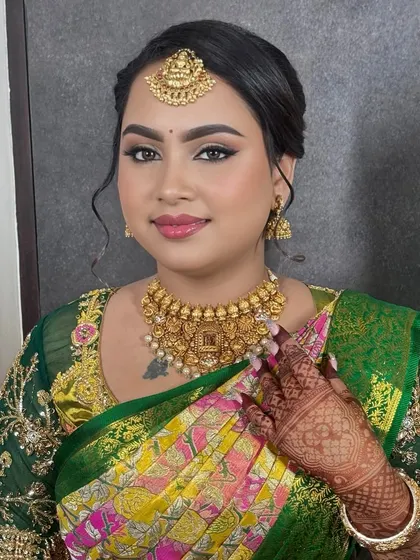 Dolled up this beauty for her engagement ceremony. The makeup features a soft glam eye, defined brows, and a rosy lip, all coming together for a gorgeous and radiant look.