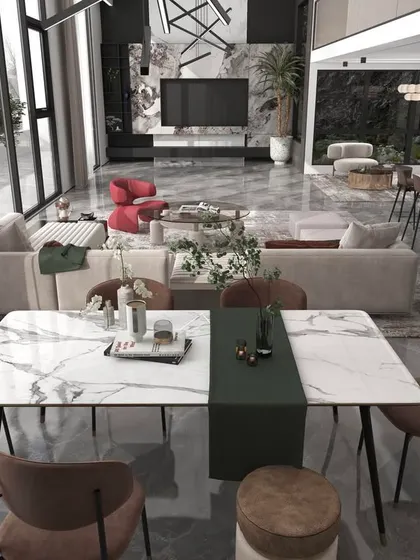 This shot connects the dining area with the living room, demonstrating a cohesive design language across a large, open-plan luxury space.