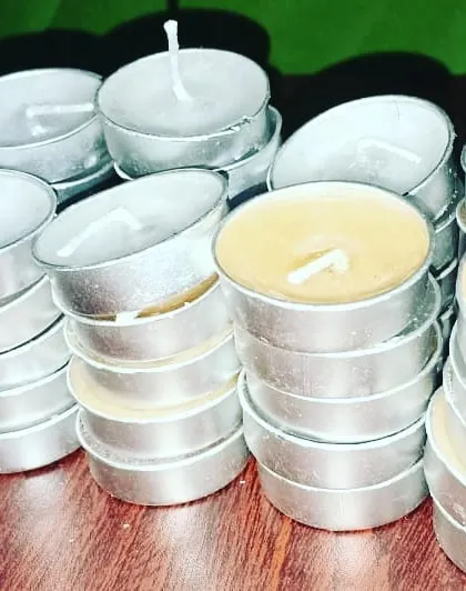 Stacks of my handmade tealights, showing how they are prepared for bulk orders. These are perfect for businesses like hotels and restaurants.