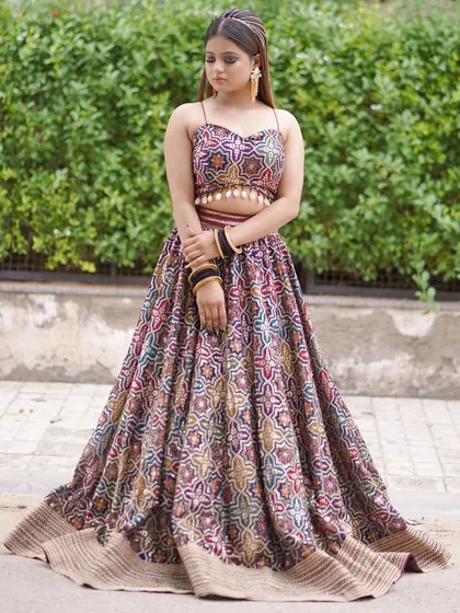 A poised, full-length shot of the printed lehenga, showing its modern strappy blouse and flattering A-line cut.