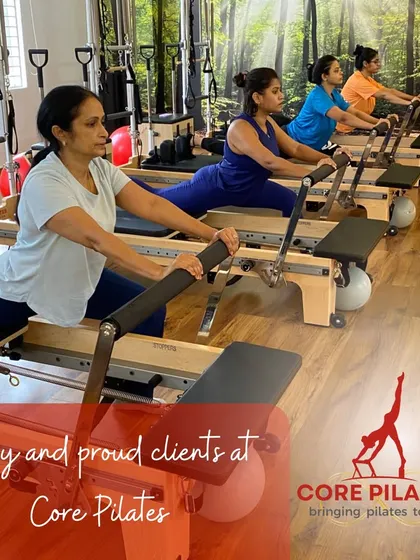 We celebrate our happy and proud clients every day. This shot captures the focus and dedication of a group performing the Eve's Lunge, a fantastic stretch for the hips and quads.