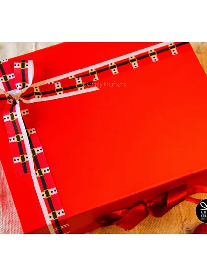 We love festive packaging! This Santa-belt ribbon adds the perfect touch to our Christmas hampers.