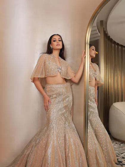 For the "Sunlit Reef" lehenga campaign, I created a warm, bronzed makeup look. This fish-cut gown is pure glamour, and the makeup reflects that with a smokey eye and shimmering skin.