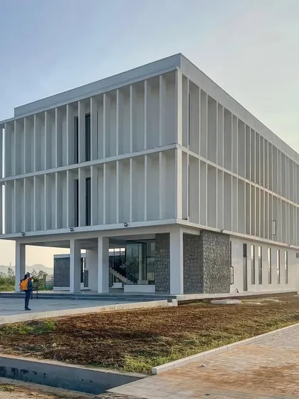 The Amaron SDC Boys Hostel in Chittoor is a 20,000 sqft project that prioritizes functionality and the well being of its residents. The design, with its deep-set windows and vertical fins, is driven by the need for thermal comfort and natural ventilation.