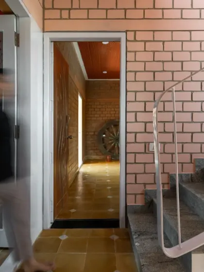 This is the entrance to EESHA, a home built as a load-bearing structure using Compressed Stabilized Earth Blocks (CSEB) to minimize concrete.