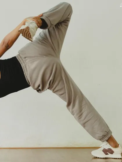 A dynamic stretch in Visvamitrasana (Visvamitra's Pose). This advanced pose combines balance, flexibility, and strength.