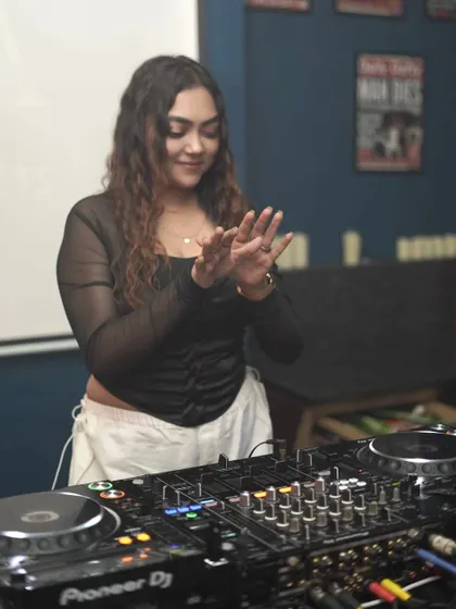 A moment of joy and gratitude behind the decks, getting ready to drop a beat.