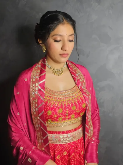 Labdhi, looking beautiful and happy in a vibrant pink lehenga.