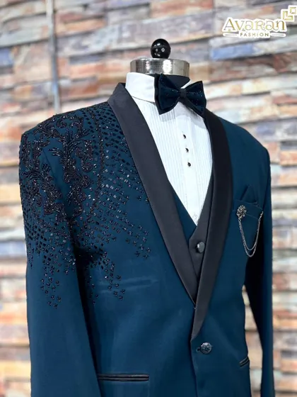 Another angle of the teal blue suit, focusing on the fit and the elegant black satin lapels that give it a classic tuxedo feel.