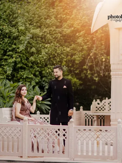 A serene pre-wedding portrait of the couple in a picturesque gazebo, using natural light to create a soft, romantic feel.