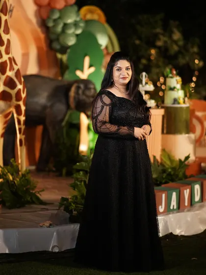 Our stunning client Supritha celebrating her son's birthday in a beautifully customized black gown.
